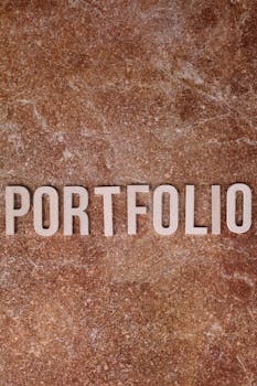Portfolio text on a textured stone background, perfect for business themes.